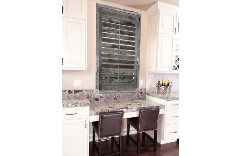 Reclaimed wood shutters on kitchen window in Austin